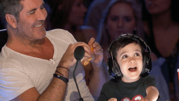 Simon with his son in the set of America’s Got Talent